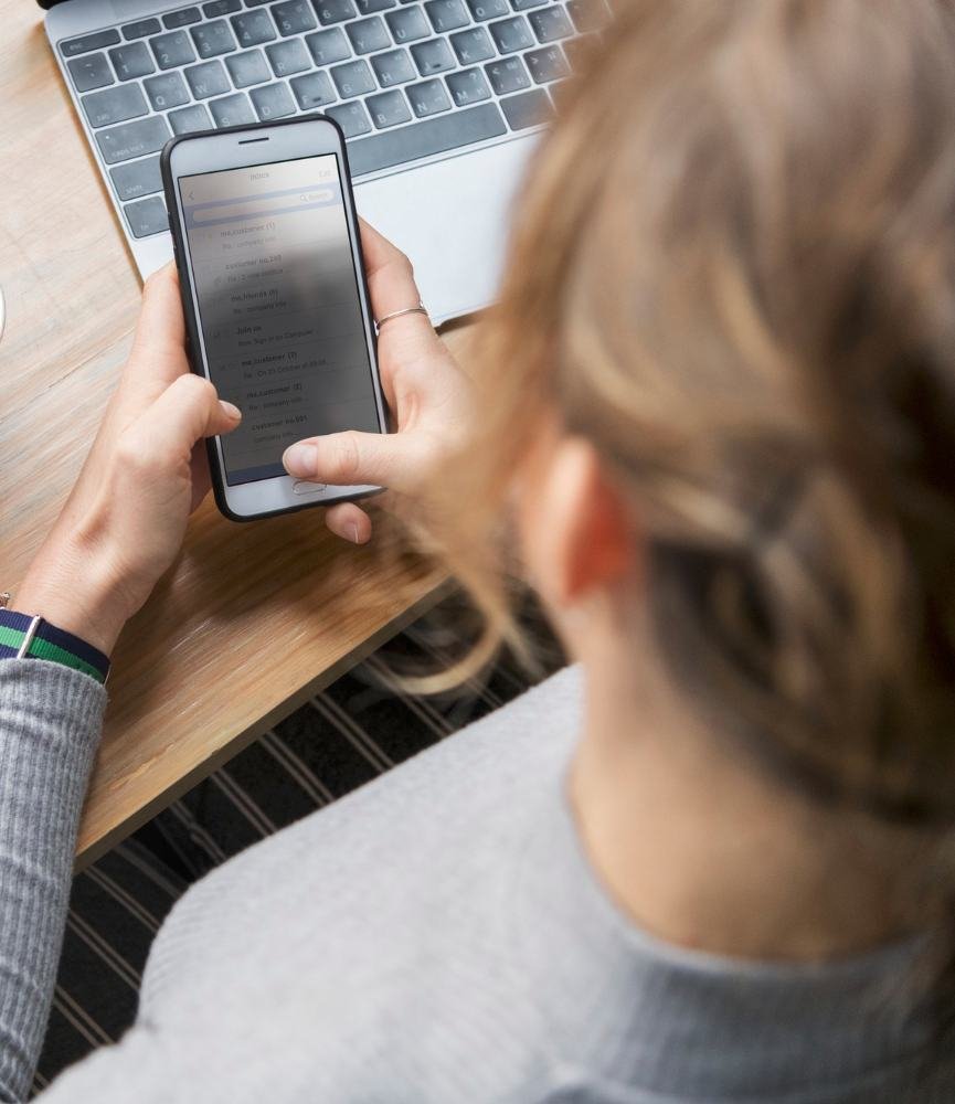 Blond woman texting on her phone